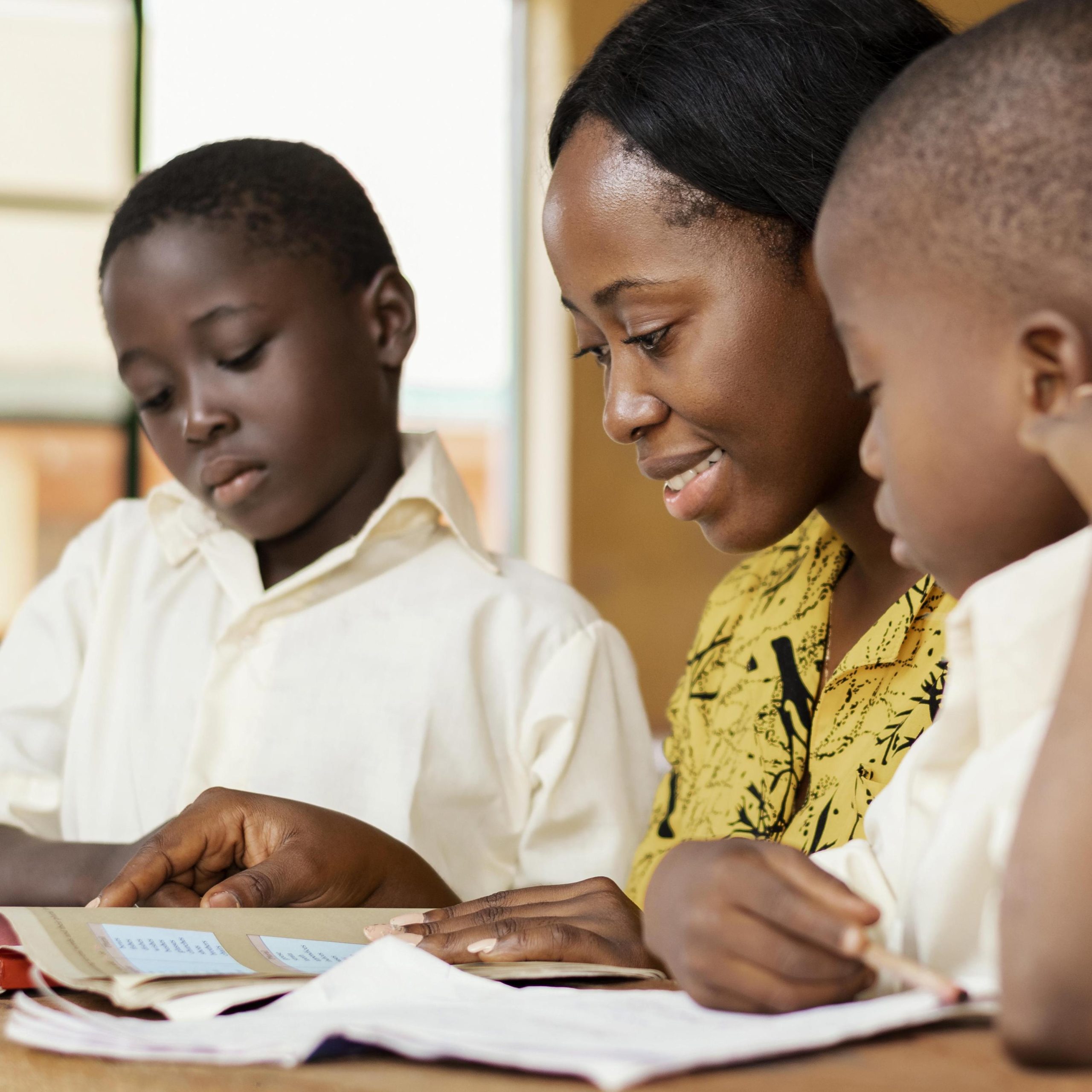 teacher-helping-kids-class